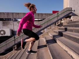 woman jogging on  steps photo