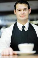 Barista prepares cappuccino photo