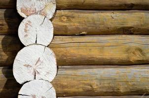 Corner of a house from a bar, logs close-up. Log house or barn. photo