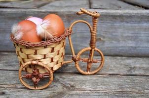 chicken eggs in a wicker basket, The concept of Easter photo