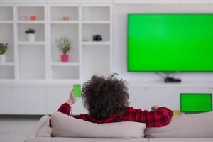 young man in bathrobe enjoying free time photo