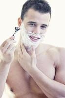 young man shaving photo