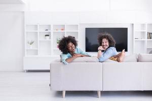 young multiethnic couple in living room photo