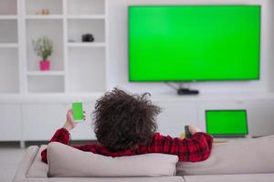 young man in bathrobe enjoying free time photo