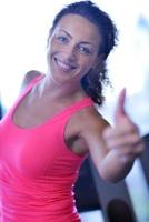 woman exercising on treadmill in gym photo