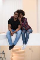 couple having break during moving to new house photo