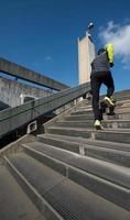 man jogging on steps photo