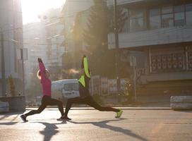 couple warming up before jogging photo