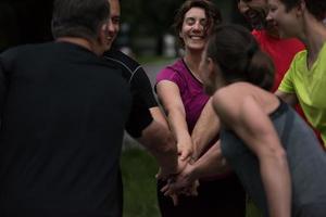 runners giving high five to each other photo