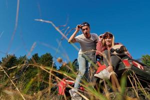 couple enjoying beautiful sunny day while driving a off road buggy photo