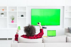 young man in bathrobe enjoying free time photo