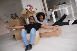 African American couple  playing with packing material photo