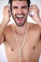 handsome young man listening music on headphones photo