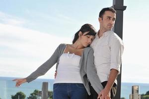 couple relaxing on balcony photo