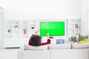 young man in bathrobe enjoying free time photo