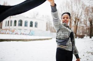 African woman wear in black scarf pose in winter day at Europe. photo