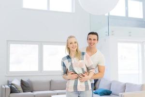 couple hugging in their new home photo