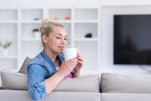 woman enjoying a cup of coffee photo