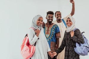 Group of happy african students having conversation and team meeting working together on homework girls wearing traidiional sudan muslim hijab fashion photo