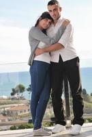 couple relaxing on balcony photo