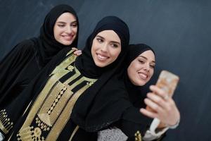 Portrait of Arab women wearing traditional clothes or abaya photo