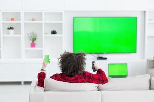 young man in bathrobe enjoying free time photo