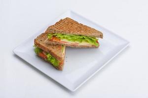 sandwich on a white surface photo