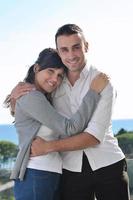 couple relaxing on balcony photo