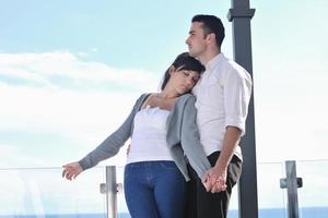 couple relaxing on balcony photo