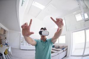 man using VR-headset glasses of virtual reality photo