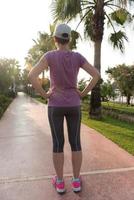 woman  stretching before morning jogging photo