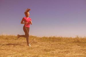 young woman jogging photo