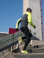 man jogging on steps photo