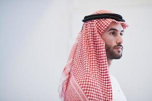 young arabian businessman using smartphone at home photo