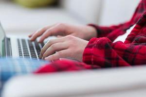 man freelancer in bathrobe working from home photo