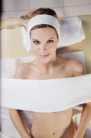 Beautiful young woman in spa photo