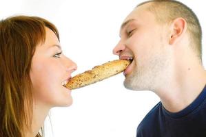 happy couple eating croissant photo