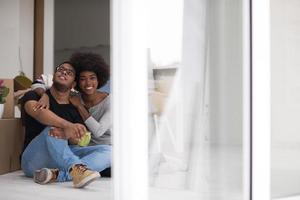 African American couple relaxing in new house photo