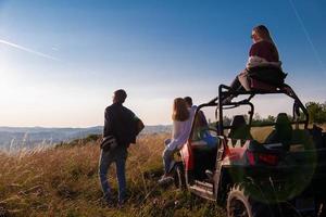 group of young people driving a off road buggy car photo