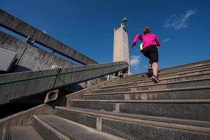 sporty woman jogging on morning photo