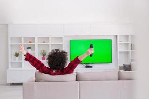 young man in bathrobe enjoying free time photo