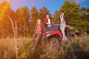 group of young people driving a off road buggy car photo