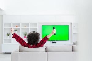 young man in bathrobe enjoying free time photo