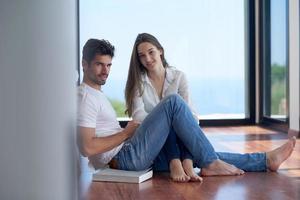 relaxed young couple at home staircase photo