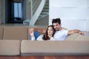 relaxed young couple at home staircase photo