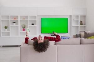 young man in bathrobe enjoying free time photo