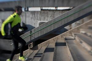 man jogging on steps photo