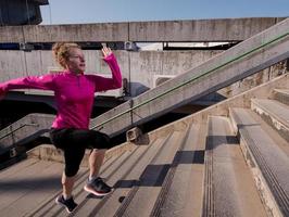 woman jogging on  steps photo