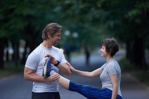 jogging couple stretching photo