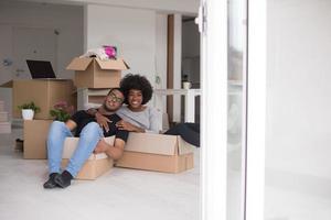 African American couple  playing with packing material photo